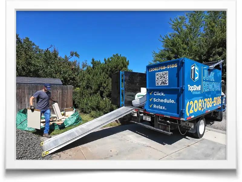 Top Shelf junk removal team hauling away old furniture and debris - same day junk hauling service in Boise Idaho